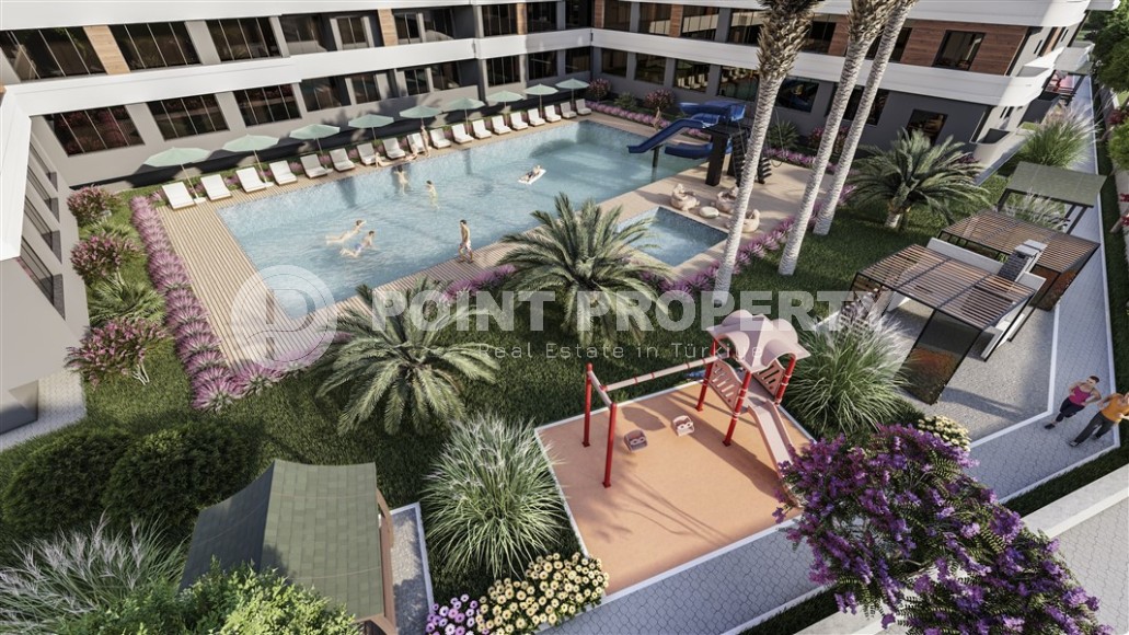 Студии и линейные квартиры в строящемся жилом комплексе, в центре перспективного района Мерсина - Томюк-id-7529-фото-10