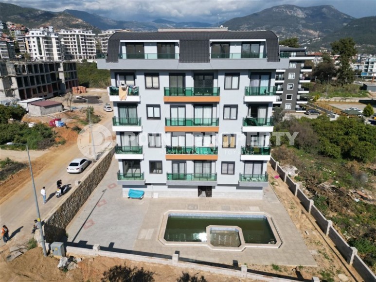 Small ready-to-move-in apartment 1+1, with a total area of 50 m2, in a new, investment-attractive area of Alanya - Upper Oba-id-7587-photo-10