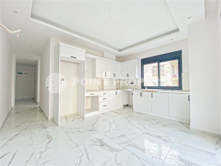 Квартира с чистовой отделкой на 2-м этаже в резиденции 2023 года постройки, в современном районе центральной части Аланьи - Гюллер Пынары-id-7658-фото-3