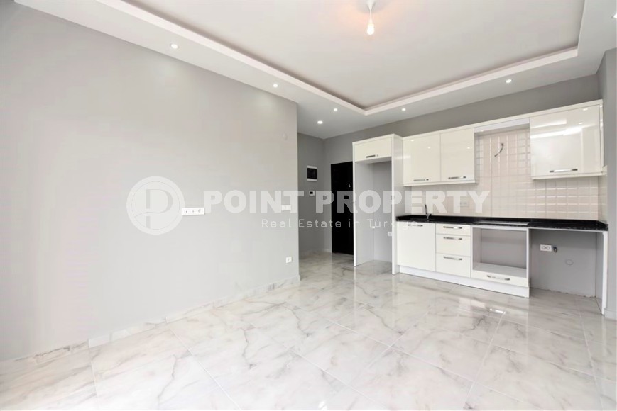 Квартира 1+1 с выходом на просторную лужайку, в перспективном районе Аланьи - Верхняя Оба-id-7692-фото-2