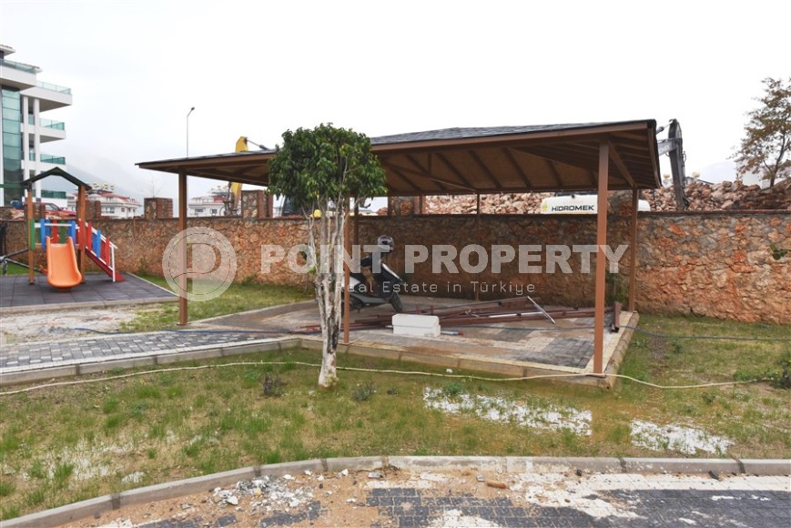 Квартира 1+1 с выходом на просторную лужайку, в перспективном районе Аланьи - Верхняя Оба-id-7692-фото-12