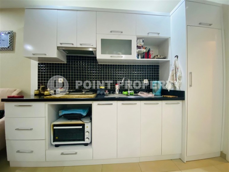 Compact studio 1+0 with a spacious glazed balcony, in the center of the modern area of Alanya - Mahmutlar-id-7713-photo-3