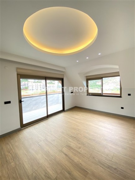 Large two-level apartment 5+1, with a total area of 395 m2, in the prestigious area of Alanya - Hasbahce-id-7730-photo-11