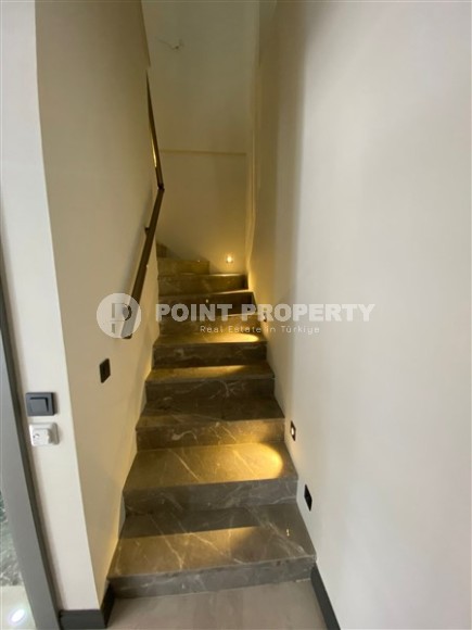 New two-level 3+1 apartment in an elite residential complex with a “city within a city” infrastructure, in a quiet area of Alanya - Kargicak-id-7733-photo-9