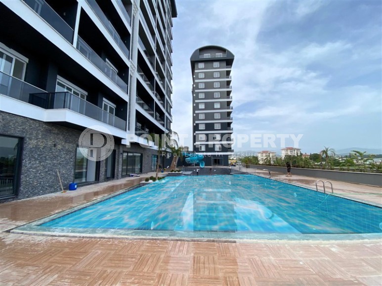 Compact 1+1 apartment, with a total area of 55 m2, in a promising area of Alanya - Avsallar-id-7748-photo-18