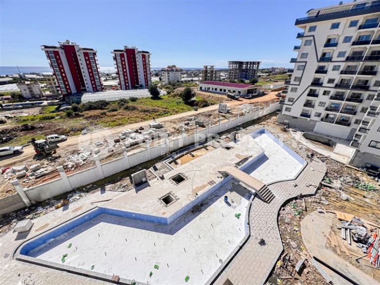 Apartment 1+1 on the 5th floor in a residential complex under construction, 2250 meters from the sea-id-7760-photo-12