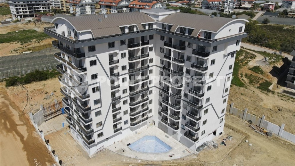 Apartment 1+1 on the 5th floor in a residential complex under construction, 2250 meters from the sea-id-7760-photo-14