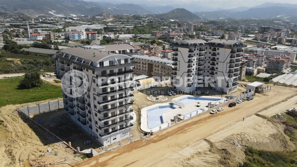 Apartment 1+1 on the 5th floor in a residential complex under construction, 2250 meters from the sea-id-7760-photo-15