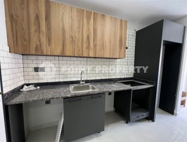 Affordable 1+1 apartment with a total area of 40 m2, with a top location within walking distance from the sea, in the center of Mahmutlar-id-7762-photo-2