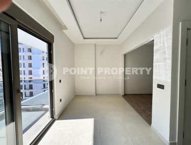 Affordable 1+1 apartment with a total area of 40 m2, with a top location within walking distance from the sea, in the center of Mahmutlar-id-7762-photo-3