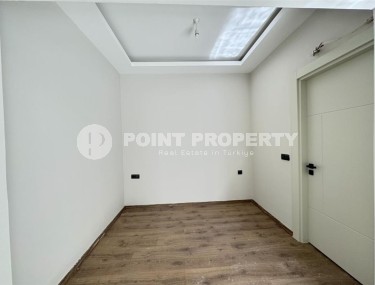 Affordable 1+1 apartment with a total area of 40 m2, with a top location within walking distance from the sea, in the center of Mahmutlar-id-7762-photo-4