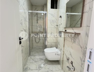 Affordable 1+1 apartment with a total area of 40 m2, with a top location within walking distance from the sea, in the center of Mahmutlar-id-7762-photo-5