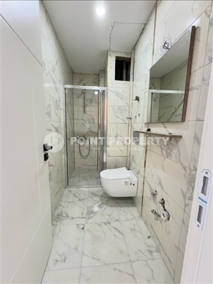 Affordable 1+1 apartment with a total area of 40 m2, with a top location within walking distance from the sea, in the center of Mahmutlar-id-7762-photo-5