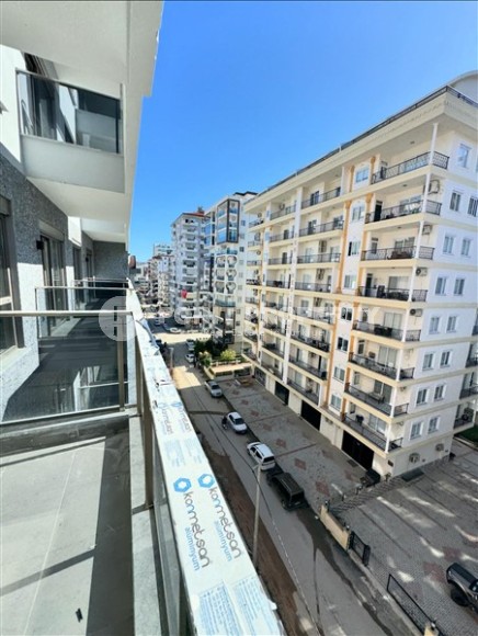 Affordable 1+1 apartment with a total area of 40 m2, with a top location within walking distance from the sea, in the center of Mahmutlar-id-7762-photo-6