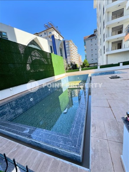 Affordable 1+1 apartment with a total area of 40 m2, with a top location within walking distance from the sea, in the center of Mahmutlar-id-7762-photo-8