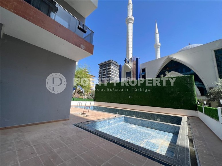 Affordable 1+1 apartment with a total area of 40 m2, with a top location within walking distance from the sea, in the center of Mahmutlar-id-7762-photo-9