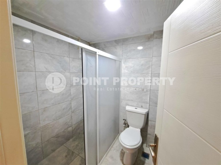 Advantageous offer - inexpensive apartment with high-quality renovation, on the 1st floor in the center of Mahmutlar district-id-7765-photo-12