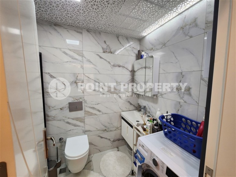 Благоустроенная квартира с современным дизайном в 150 метрах от моря, в центре популярного района Аланьи - Махмутлар-id-7789-фото-9