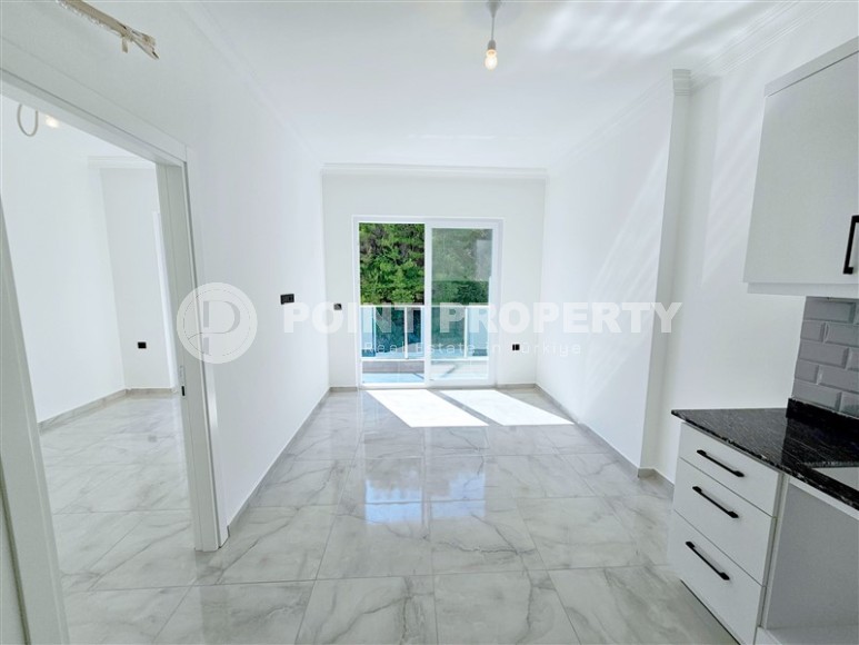 New 1+1 apartment with high-quality finishing, in a quiet area of Alanya - Avsallar-id-7807-photo-2