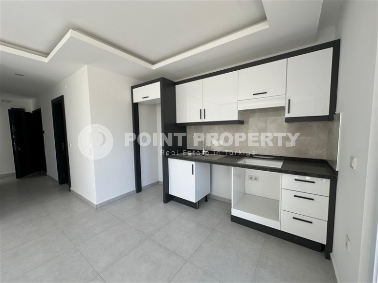 Доступная по цене новая квартира с качественной чистовой отделкой, в популярном курортном районе Аланьи - Авсаллар-id-7817-фото-4