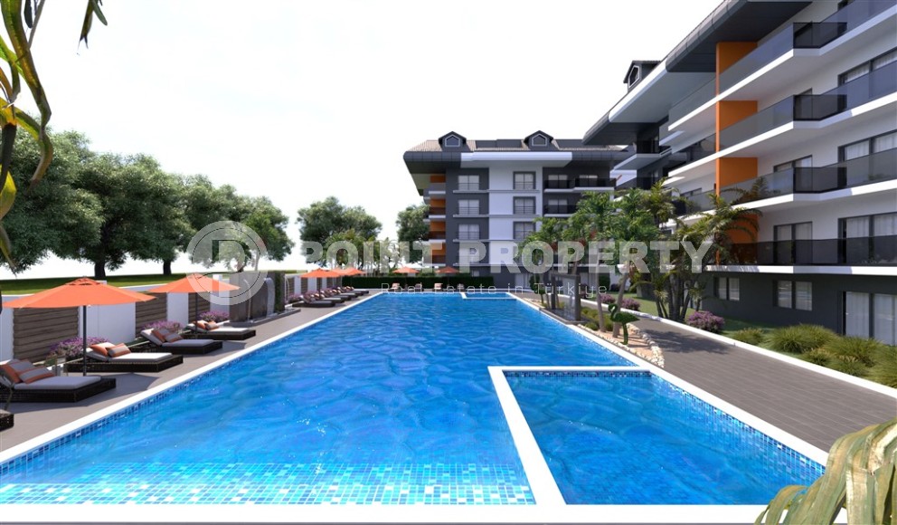 Новый инвестиционный проект в перспективном районе Аланьи - Окурджалар - жилой комплекс с отельной инфраструктурой в 200 метрах от моря-id-7818-фото-2