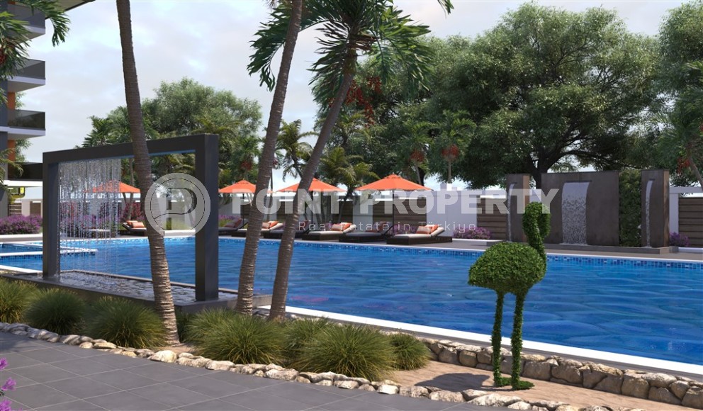 Новый инвестиционный проект в перспективном районе Аланьи - Окурджалар - жилой комплекс с отельной инфраструктурой в 200 метрах от моря-id-7818-фото-5