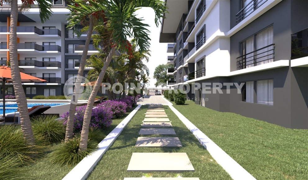 Новый инвестиционный проект в перспективном районе Аланьи - Окурджалар - жилой комплекс с отельной инфраструктурой в 200 метрах от моря-id-7818-фото-11