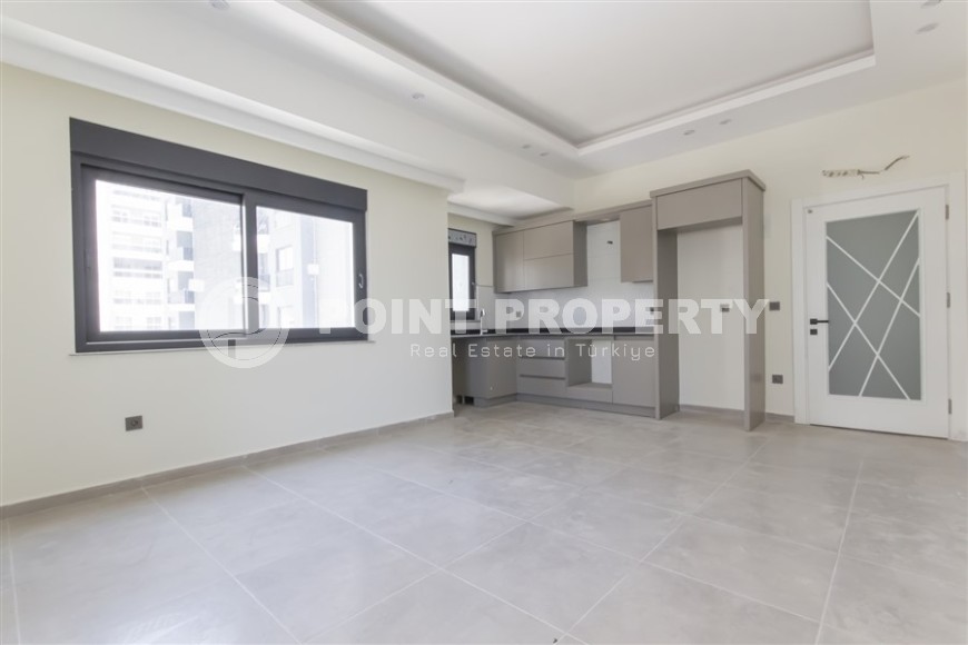 Квартира 1+1 с качественной чистовой отделкой в 500 метрах от моря, в центре района Махмутлар-id-7832-фото-2