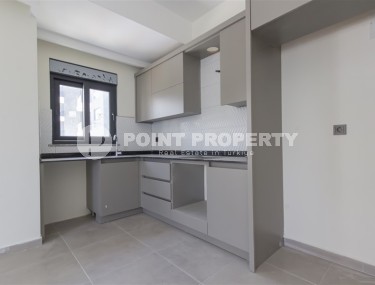 Квартира 1+1 с качественной чистовой отделкой в 500 метрах от моря, в центре района Махмутлар-id-7832-фото-4