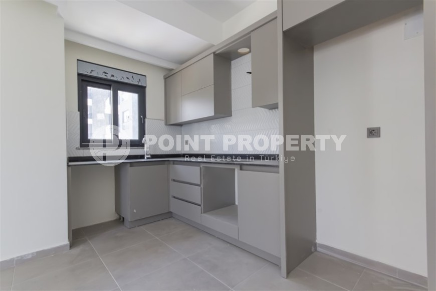 Квартира 1+1 с качественной чистовой отделкой в 500 метрах от моря, в центре района Махмутлар-id-7832-фото-4