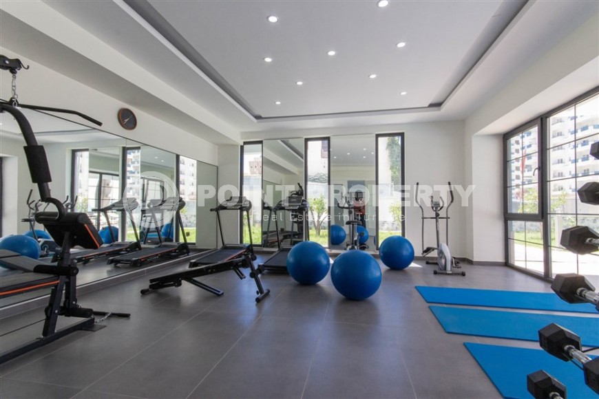 Квартира 1+1 с качественной чистовой отделкой в 500 метрах от моря, в центре района Махмутлар-id-7832-фото-10