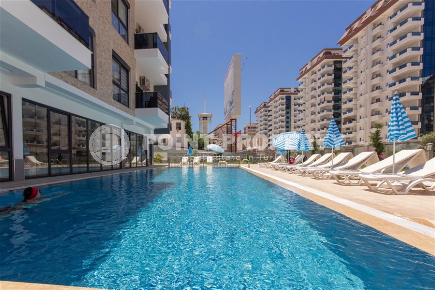 Квартира 1+1 с качественной чистовой отделкой в 500 метрах от моря, в центре района Махмутлар-id-7832-фото-15