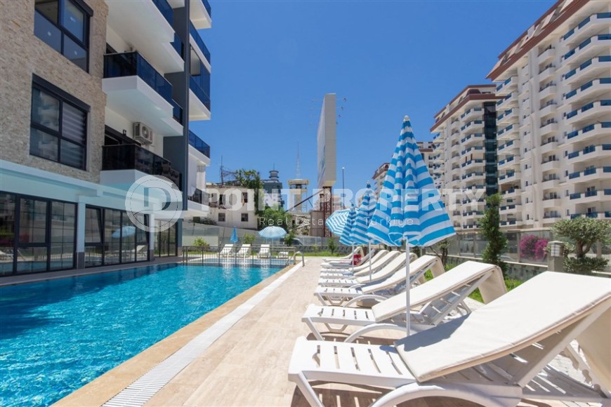 Квартира 1+1 с качественной чистовой отделкой в 500 метрах от моря, в центре района Махмутлар-id-7832-фото-16