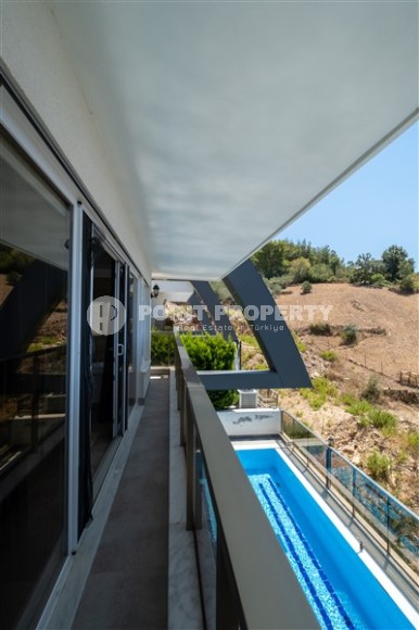 Modern three-storey villa with a swimming pool and a garden in a picturesque, ecologically clean area of Alanya - Kargicak-id-7838-photo-17