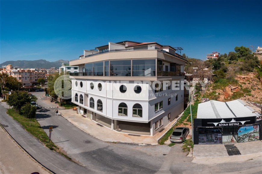 New four-storey building for commercial outlets in the prestigious resort area of Alanya - Kestel-id-7842-photo-2