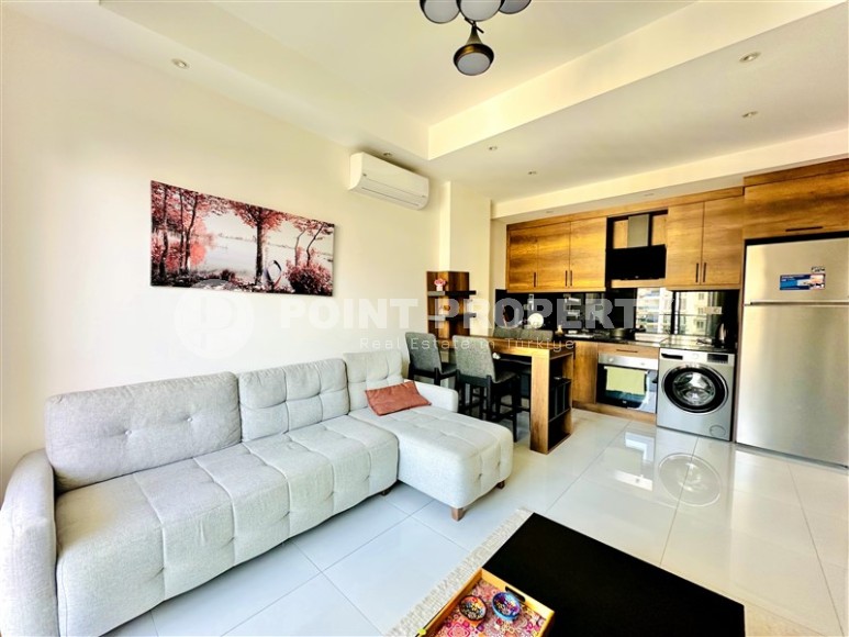 Bright, comfortable apartment with views of the city and the Taurus Mountains, in the center of the popular area of Alanya - Mahmutlar-id-7863-photo-2