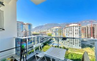 Bright, comfortable apartment with views of the city and the Taurus Mountains, in the center of the popular area of Alanya - Mahmutlar-id-7863-photo-7
