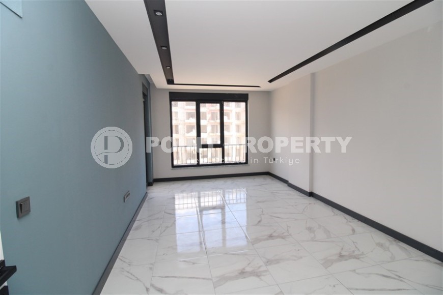 Просторная линейная квартира 2+1 с чистовой отделкой, в центре района Махмутлар-id-7884-фото-2