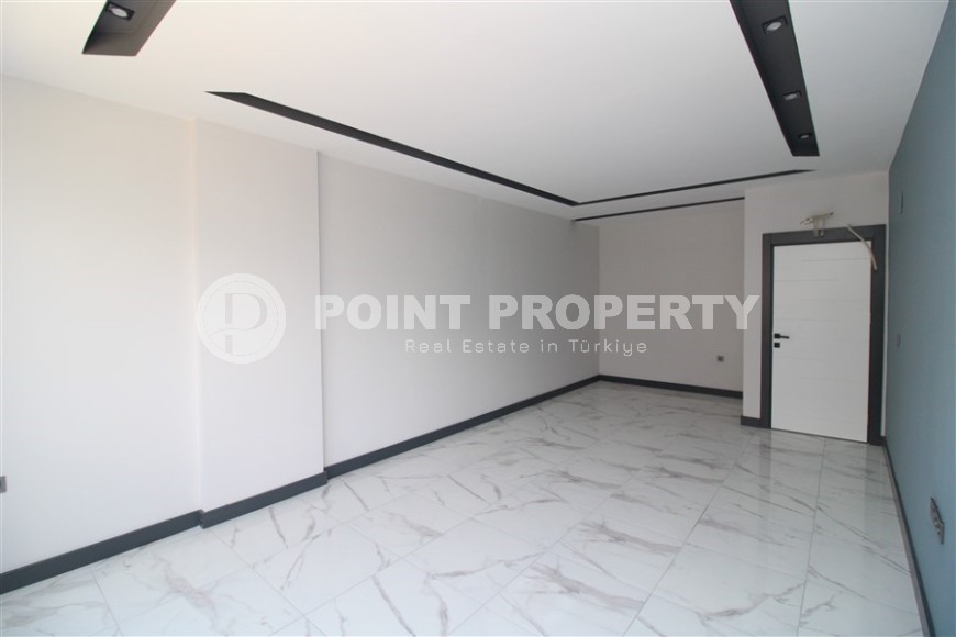 Просторная линейная квартира 2+1 с чистовой отделкой, в центре района Махмутлар-id-7884-фото-3