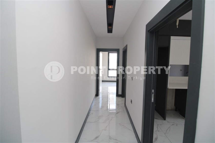 Просторная линейная квартира 2+1 с чистовой отделкой, в центре района Махмутлар-id-7884-фото-7