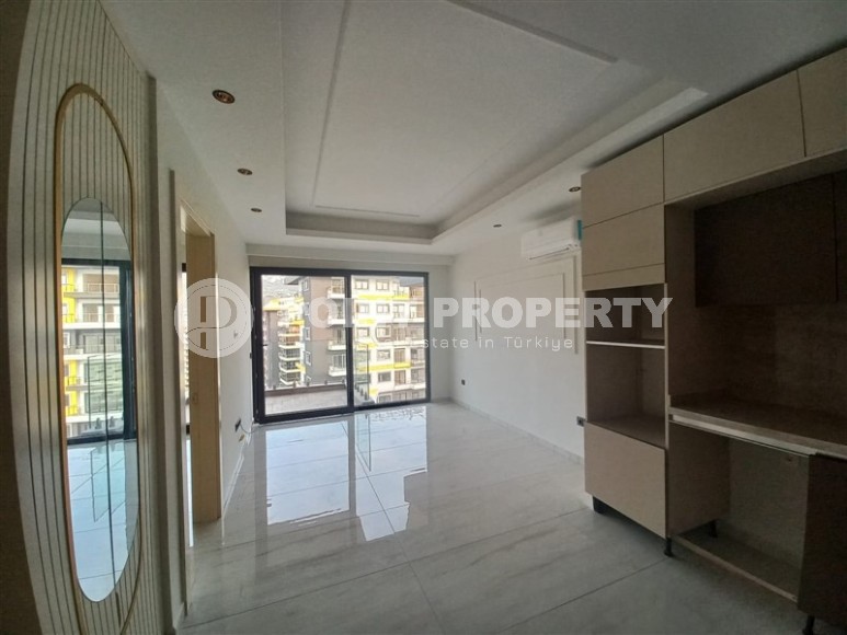 New apartment with a luxurious location on the first line from the sea, in the center of Mahmutlar-id-7901-photo-4