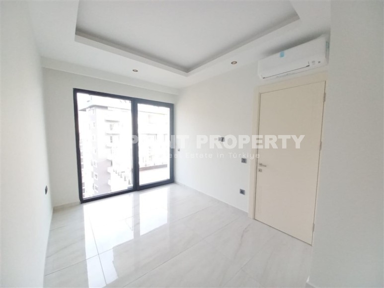 New apartment with a luxurious location on the first line from the sea, in the center of Mahmutlar-id-7901-photo-7