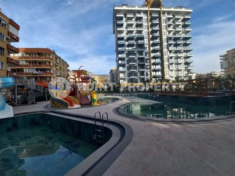 New apartment with a luxurious location on the first line from the sea, in the center of Mahmutlar-id-7901-photo-14