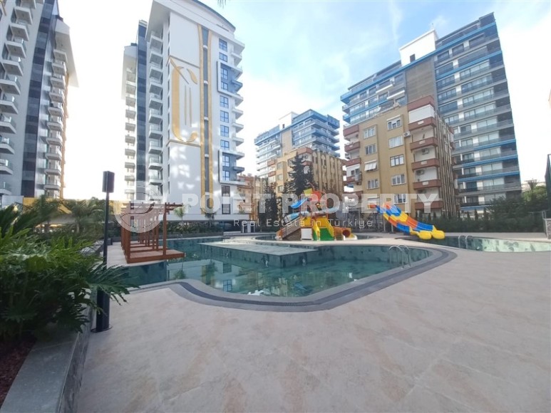 New apartment with a luxurious location on the first line from the sea, in the center of Mahmutlar-id-7901-photo-15