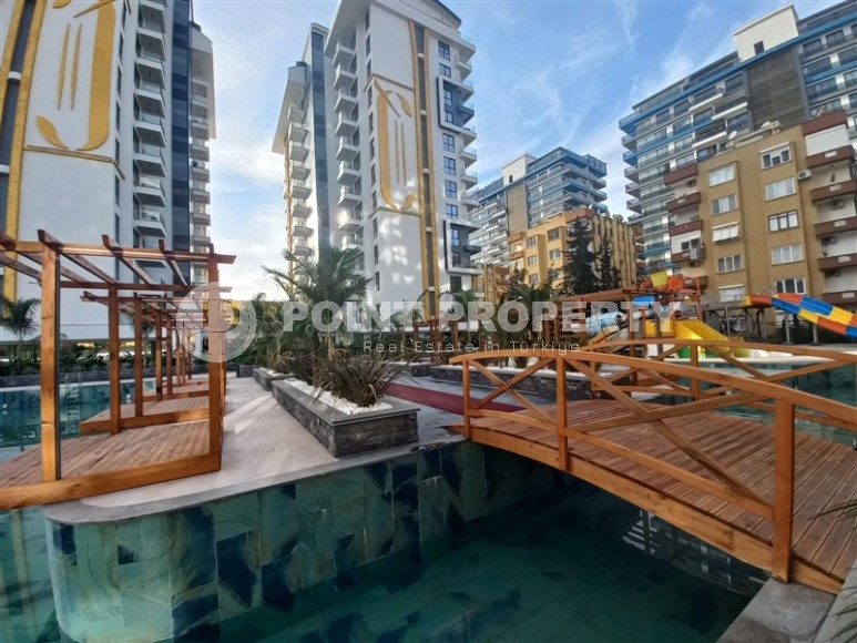 New apartment with a luxurious location on the first line from the sea, in the center of Mahmutlar-id-7901-photo-16