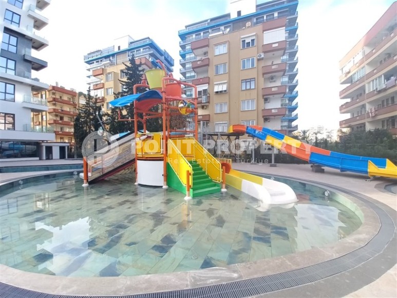 New apartment with a luxurious location on the first line from the sea, in the center of Mahmutlar-id-7901-photo-18