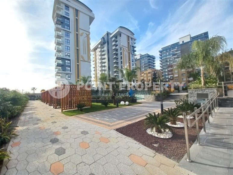 New apartment with a luxurious location on the first line from the sea, in the center of Mahmutlar-id-7901-photo-21