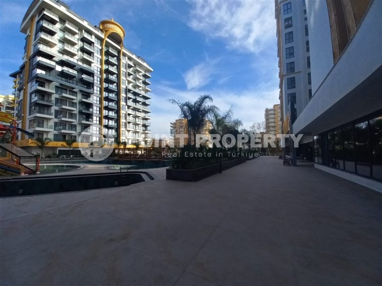 New apartment with a luxurious location on the first line from the sea, in the center of Mahmutlar-id-7901-photo-24