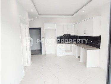 Inexpensive apartment with fine finishing 1200 meters from the sea, in the promising resort area of Alanya - Avsallar-id-7904-photo-2