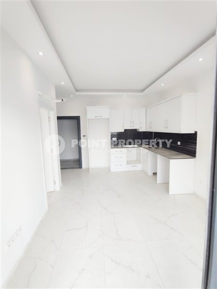 Inexpensive apartment with fine finishing 1200 meters from the sea, in the promising resort area of Alanya - Avsallar-id-7904-photo-2